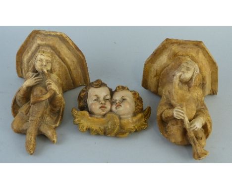 A pair of continental plaster corbels or wall brackets, each moulded with a medieval style musician playing an instrument, 17