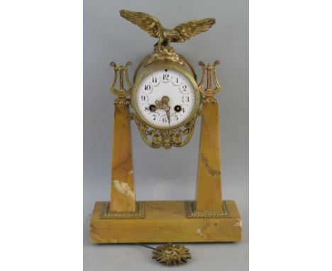 A French empire style marble portico clock, with brass eight day movement inscribed "Japy Freres" striking on a bell, the ena