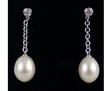 A pair of pearl and diamond drop earrings, each comprising a pear shaped cultured pearl suspended from a diamond set in 18ct 