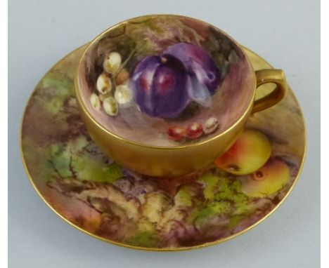 A Royal Worcester small cabinet cup and saucer, painted with fruit, the cup signed Ricketts, the saucer signed W H Austin, da