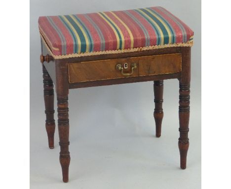 A 19th Century mahogany framed piano stool, the oblong over upholstered top having frieze drawer with brass loop handle, on r
