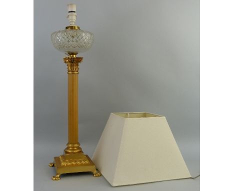 An early 20th Century Corinthian column table lamp, with gilt brass stepped square base and capital and reeded bakolite stem 