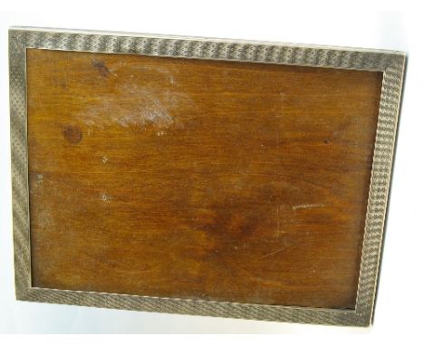 A photograph frame, having oblong aperture with engine turned surround and oak strut support, 22cm high, Birmingham 1927