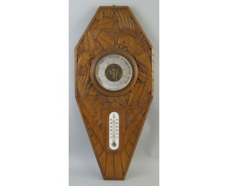 A French Art Deco oak combined aneroid barometer and thermometer, of elongated octagonal form, the 13cm dial inscribed "G BAY