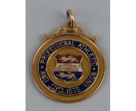 A 9ct gold and enamelled medal, for The Professional, Athletic & Cyclists Union, of circular form inscribed "Half Mile Champi