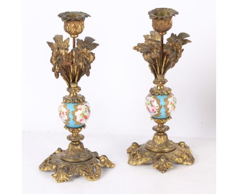 A pair of 19th century French 'Sevres' style porcelain gilt candlesticks, with foliate sconces and stems above central turquo