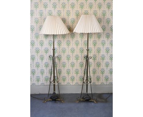 having a reeded column with scroll supports wand floral banding, raised on a gadrooned base with arrow shaped feet, 143cm hig