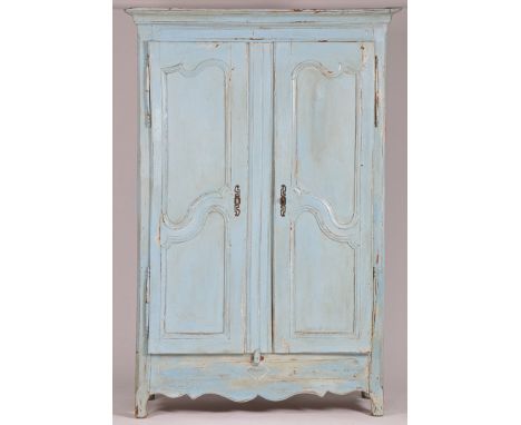 with light blue painted exterior, the downswept pediment above two shaped panelled cupboard doors opening to reveal two inter