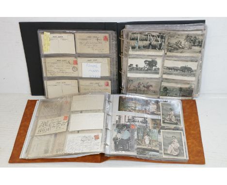 Collection of early 20th century postcards contained within two albums, to include an album of Australian postcards (mostly K