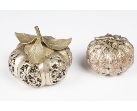 A vintage white metal betal nut holder in the form of a pumpkin with ornate pierced decoration together with a silver plated 