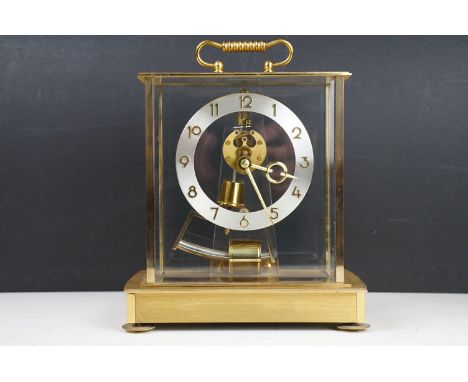 Mid 20th C Kundo electronic skeleton mantel clock, the brass case with four bevelled glass panels, presentation inscription t