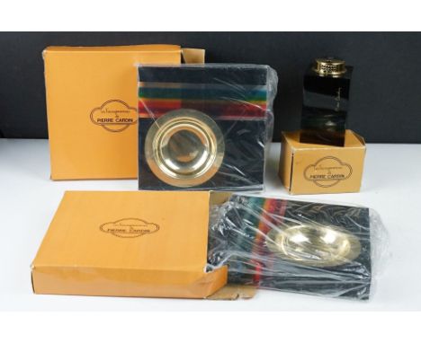 A pair of boxed Pierre Cardin designer ashtrays together with a table lighter. 