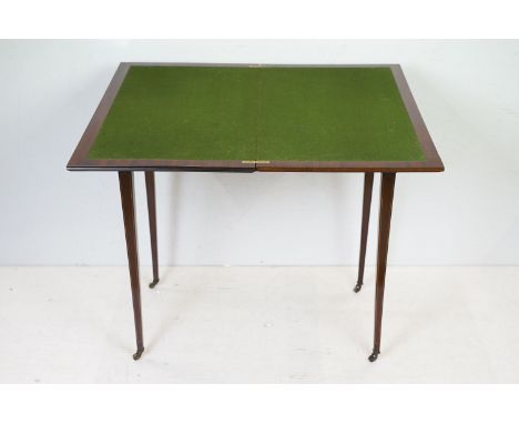 Edwardian Mahogany Inlaid Rectangular Card Table, the fold-over top opening to a green baise playing surface, raised on squar