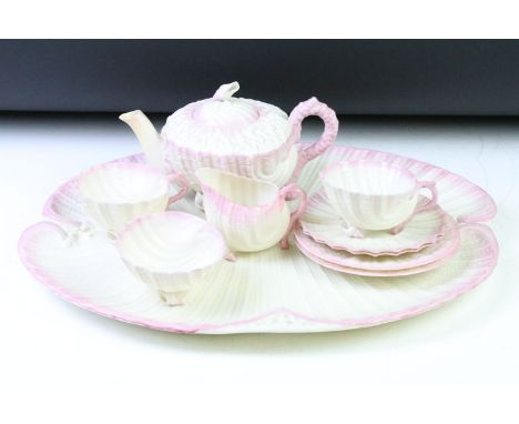 Late 19th / early 20th C Belleek Porcelain 'Neptune' pink shell pattern cabaret tea set for two, comprising teapot, 2 cups &a