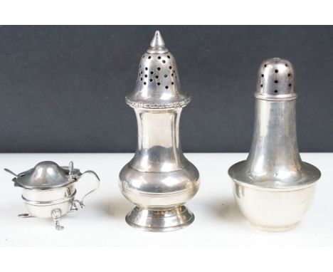 A fully hallmarked sterling silver sugar shakers together with a silver plated examples and a hallmarked silver mustard pot. 