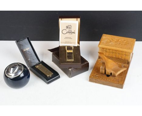 A small group of smoking related collectables to include pocket lighters, cigarette dispenser and a table lighter. 