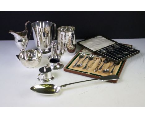 A small collection of mixed silver plated to include cased spoon sets, tankards, serving spoon.... etc... 