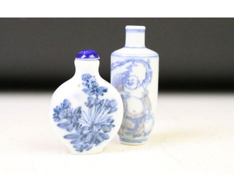 Two 18th / 19th Century Chinese blue & white porcelain snuff bottles, the tallest decorated with a Buddha, the other with flo