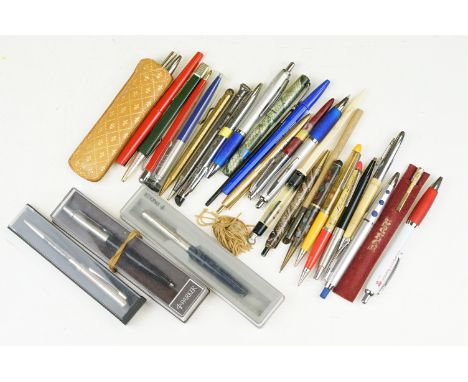 A collection of vintage and contemporary pens and pencils to include gold nibbed fountain pen and sterling silver pencil.