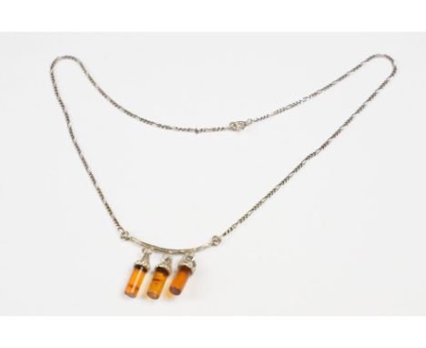 A contemporary 925 sterling silver necklace with three amber style hanging drops on Figaro chain, marked 925 for sterling sil