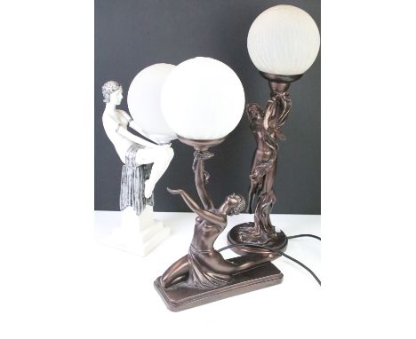 Three Art Deco style table lamps to include two bronzed base examples with female figures, and one white and silvered lamp ba