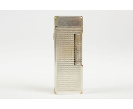 A mid 20th century silver plated Dunhill pocket lighter with service reciept. 
