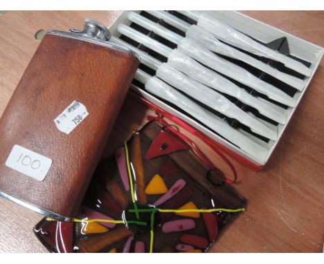 A box of flatware, a Viking leather clad hip flask and art glass