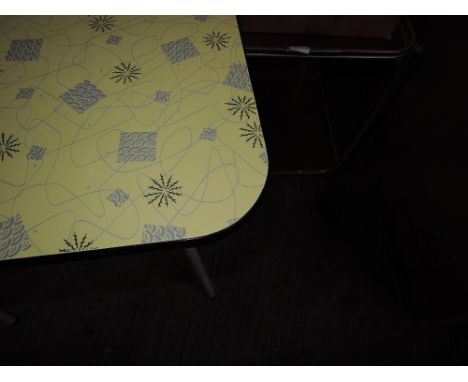 A vintage formica topped kitchen table and tea trolley