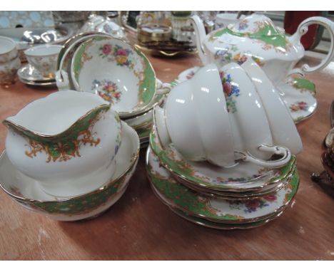 A part tea service by Paragon cream with floral design 