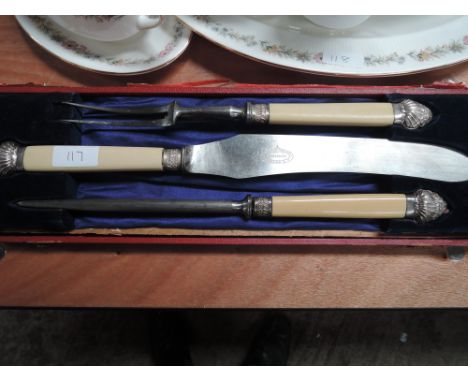 A vintage carving set with white metal decoration