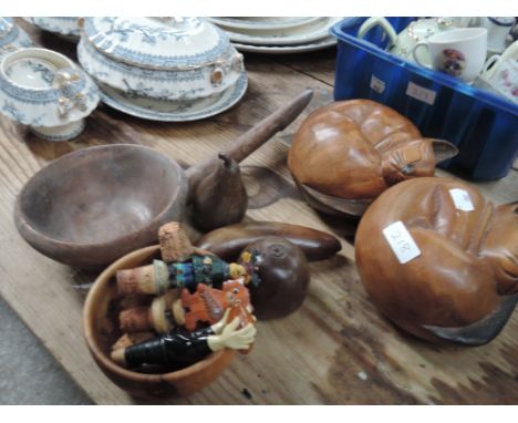 A selection of treen including carved cats and vintage measuring scoop