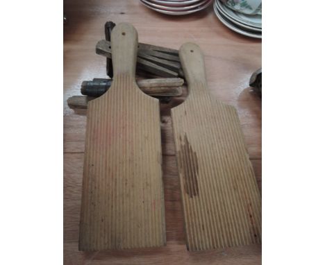 A pair of vintage butter pats and vintage clothes pegs