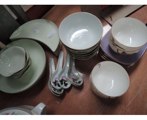 A selection of oriental style tea bowls and saucers