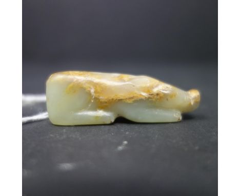 A 19th century Chinese carved jade pendant in the form of a pig, H.1.6 W.5 D.1.2cm 