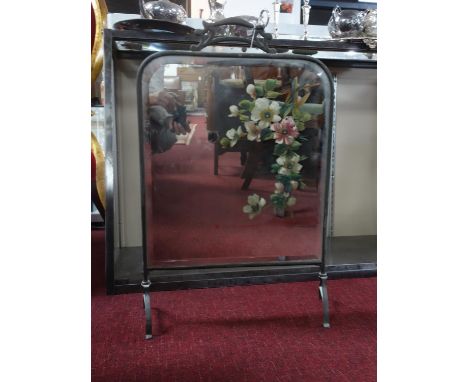 A mirrored glass fire screen, with painted floral decoration, H.70 W.45 D.19cm 
