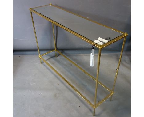 A contemporary rectangular gilt metal console table with mirrored top, H.67 W.102 D.27cm 