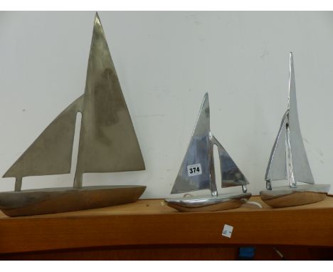 THREE ALLOY MODEL SAILING BOATS.