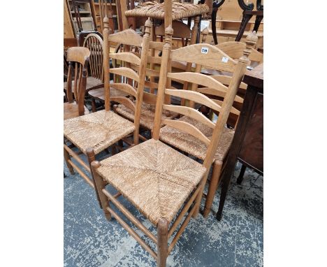 A SET OF RUSH SEAT LADDER BACK CHAIRS. 