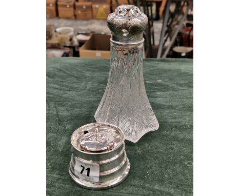 A HALLMARKED SILVER CAPSTAN SMALL INKWELL TOGETHER WITH A SILVER MOUNTED GLASS CASTOR.