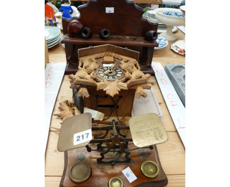 ANTIQUE POSTAGE SCALES, A CUCKOO CLOCK, A WALNUT PIPE RACK WITH BRAIR AND OTHER PIPES. 