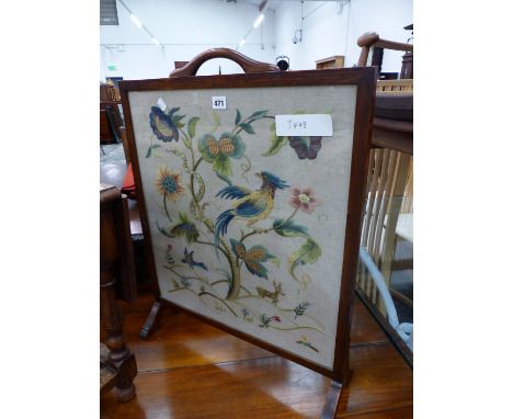 AN EMBROIDERED FIRESCREEN.