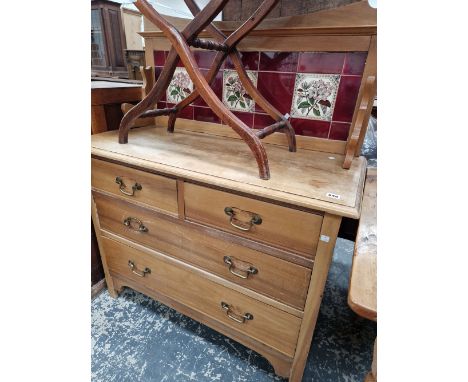AN EDWARDIAN TILE BACK DRESSING CHEST OF TWO SHORT AND TWO LONG DRAWERS. 