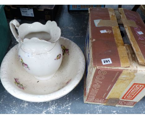 A EUMIG PROJECTOR AND A WASH JUG AND BOWL.