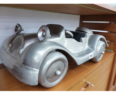 AN ALLOY LARGE MODEL OF A CAR.