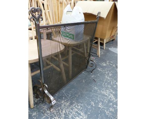 A HAND MADE WROUGHT IRON FIRE SCREEN. 