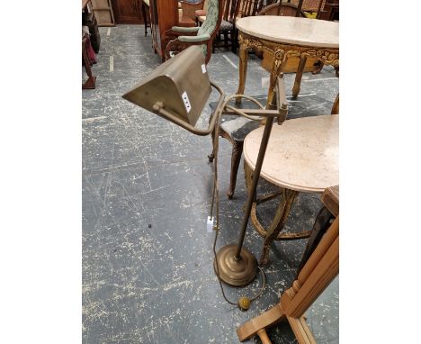 A BRASS FLOOR STANDING READING LIGHT. 