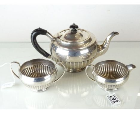 Silver Three Piece Tea Service comprising Tea Pot, Milk Jug and Sugar Bowl, each with part fluted bodies, the teapot with ebo