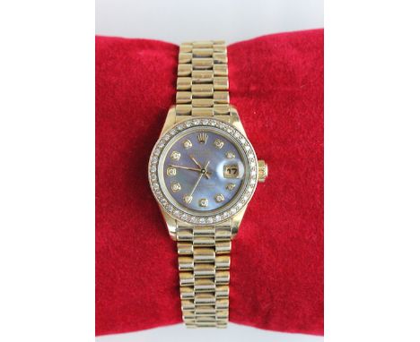 Boxed ladies Rolex Oyster Datejust Champagne wrist watch with later applied diamond bezel in 18ct yellow gold, original recei