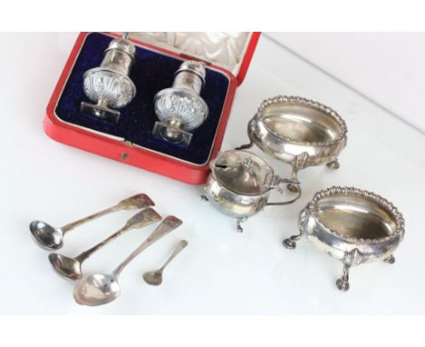 A pair of Edwardian silver salts, London 1908 , of open oval form on four supports, in the Georgian style, 7.5cm long; a silv