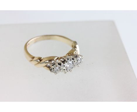 9ct Gold Ring set with a Row of Three Diamonds